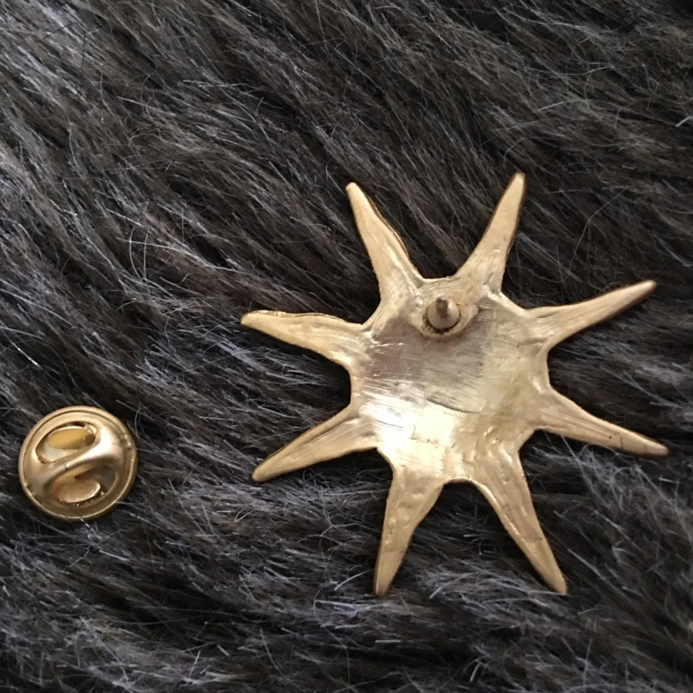 Vintage gold painted sun tac pin brooch